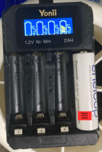 DN4 Charger in use and Charging AA battery
