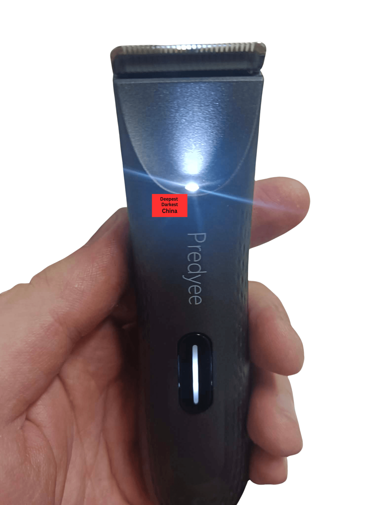 Reviewer holding Predyee RFCD-9088 Waterproof Hair Trimmer